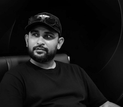 Araliya Silva, founder of Handawaka, seated, in black and white